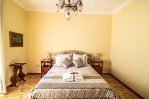 Ένα ή περισσότερα κρεβάτια σε δωμάτιο στο Scognamiglio Suites