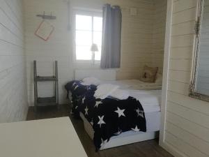 Postel nebo postele na pokoji v ubytování Väderöarnas Värdshus & Konferens
