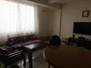 TV a/nebo společenská místnost v ubytování The River View Homestay