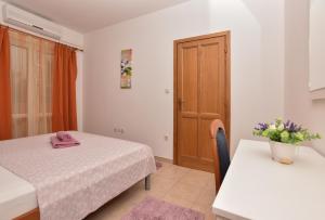 Postel nebo postele na pokoji v ubytování Villa Ivka