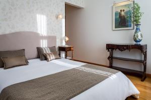 Giường trong phòng chung tại Casa Altamira