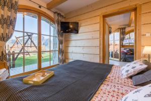 Posteľ alebo postele v izbe v ubytovaní Apartamenty Stylowe Zakopane