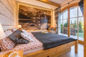 Posteľ alebo postele v izbe v ubytovaní Apartamenty Stylowe Zakopane