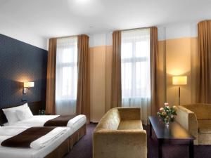 Posteľ alebo postele v izbe v ubytovaní Hotel Senator