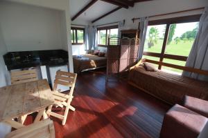 a living room with a couch and a table at Estancia Termal San Nicanor in Termas de San Nicanor