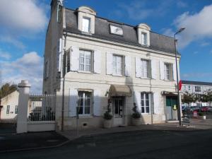 a large white building on the corner of a street at Belle Epoque in Chinon