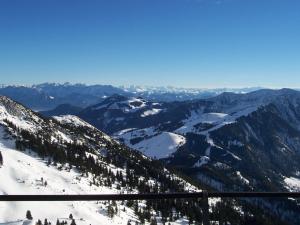 a view of a snow covered mountain range with trees at Hotel-Gasthaus Burmester in Heidenau