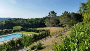 an estate with a swimming pool and trees at Erba Di Campo Residence in Quercianella