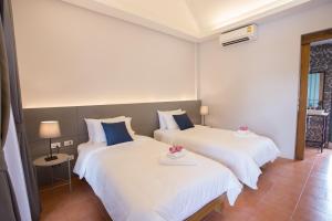 Postel nebo postele na pokoji v ubytování VIYA lodge