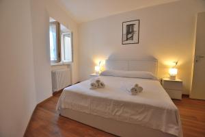 Postel nebo postele na pokoji v ubytování Apartment Del Pescatore