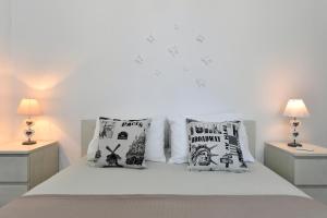 Posteľ alebo postele v izbe v ubytovaní Azzurro Bianco Suites