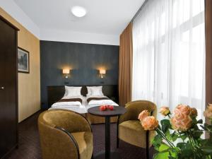 Posteľ alebo postele v izbe v ubytovaní Hotel Senator