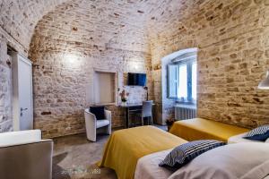A bed or beds in a room at Borgo Noci