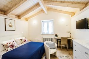 Säng eller sängar i ett rum på Borgo Noci