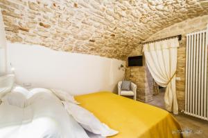A bed or beds in a room at Borgo Noci