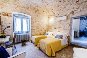 A bed or beds in a room at Borgo Noci
