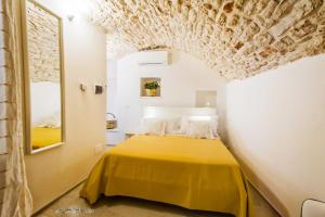 A bed or beds in a room at Borgo Noci