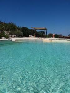 a large body of water with a gazebo in the background at Country House Martines Club Resort & Mandalay SPA in Senigallia
