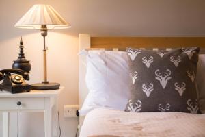 A bed or beds in a room at The Seagrave Arms 