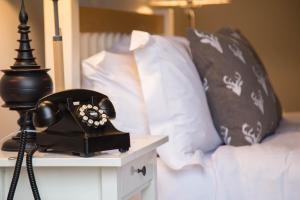 A bed or beds in a room at The Seagrave Arms 