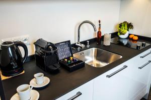 Kuchyňa alebo kuchynka v ubytovaní Apartamenty Forma Tatrica