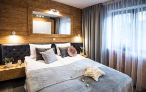 Posteľ alebo postele v izbe v ubytovaní Apartamenty Forma Tatrica