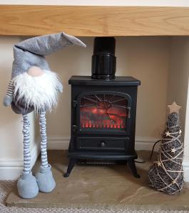 a black stove sitting in a room with at No7 Agar Street in York