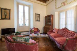 a living room with a couch and two chairs at Old Borgo Vico in Como