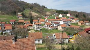 a village on a hill with red roofs at Apartmani Fučkar in Krapinske Toplice