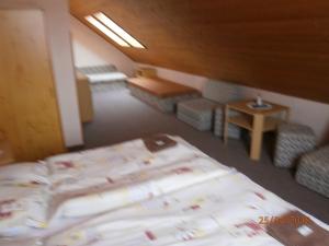 Llit o llits en una habitació de Penzion Oliver