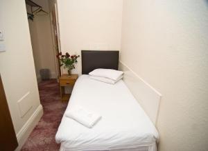 Postel nebo postele na pokoji v ubytování Charlie Hotel