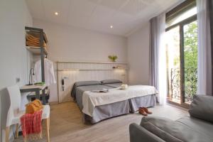 Posteľ alebo postele v izbe v ubytovaní Hostal Benidorm