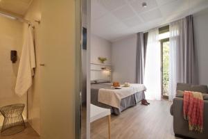 Posteľ alebo postele v izbe v ubytovaní Hostal Benidorm