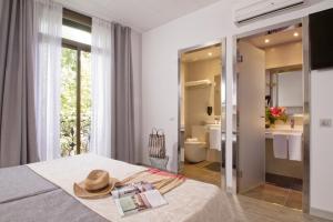 Posteľ alebo postele v izbe v ubytovaní Hostal Benidorm