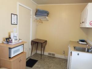 Kuchyň nebo kuchyňský kout v ubytování Melsask Motel