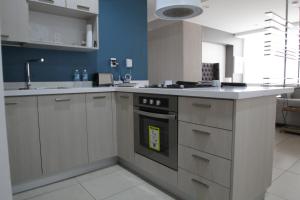 a kitchen with a stove and a sink in it at Boutique Apartment Centro Histórico-402 in Mexico City