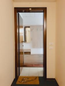 a bathroom with a glass door leading to a shower at VeniceApartment公寓 in Mestre