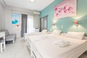 Posteľ alebo postele v izbe v ubytovaní Protopapas Rooms
