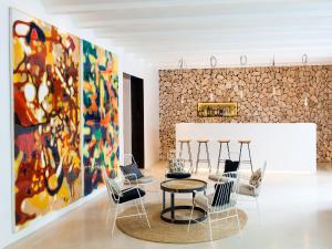 a living room filled with furniture and a painting on the wall at HM Balanguera in Palma de Mallorca