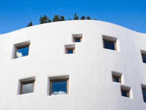 a large white building with a large window at HM Balanguera in Palma de Mallorca