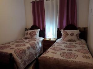 En eller flere senge i et værelse på Apartamento Sandra