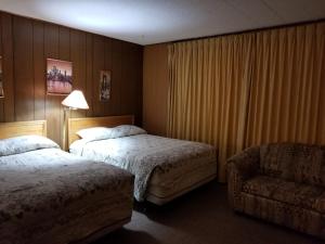 Postel nebo postele na pokoji v ubytování Melsask Motel