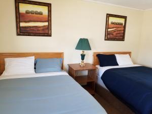 Postel nebo postele na pokoji v ubytování Melsask Motel