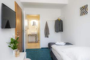 Postel nebo postele na pokoji v ubytování Hotel Inner City