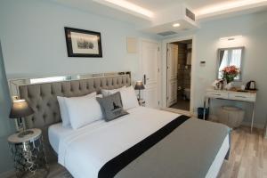 a hotel room with two beds and a mirror at Primero Hotel in Istanbul