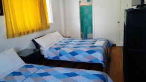 Postel nebo postele na pokoji v ubytování Hotel Ventura