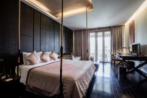 Postel nebo postele na pokoji v ubytování Aruntara Riverside Boutique Hotel