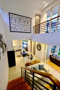 a living room with a couch and a table at Villa Arusha Jogja in Sleman +63 photos