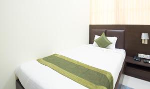Letto o letti in una camera di Treebo King'S Court Chandrasekharpur