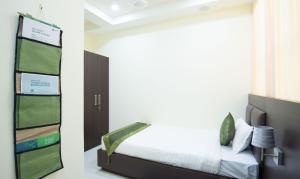 Letto o letti in una camera di Treebo King'S Court Chandrasekharpur